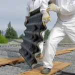 men on roof with disposable waterproof coverall bodysuit doing yard work